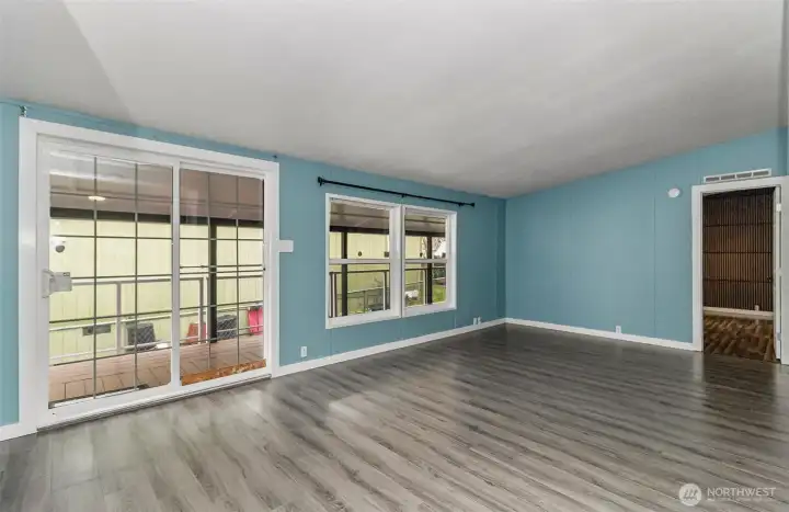 Livingroom with access to covered back deck.