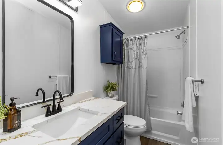 Laundry area with side door to exterior.