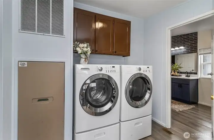Laundry area with side door to exterior.