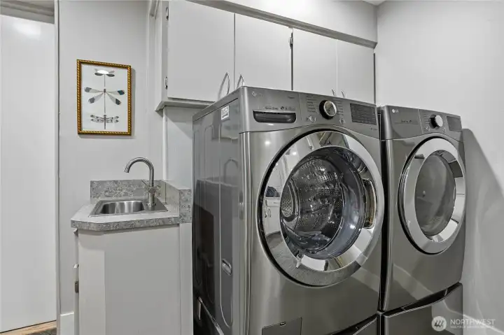 Large laundry room with storage space