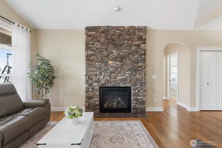 Floor to ceiling stone fireplace