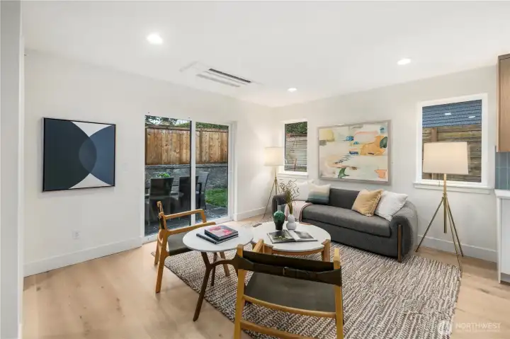 Spacious living with easy access to private backyard and patio