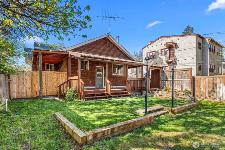 Fully fenced backyard w/ inground sprinklers & alley access