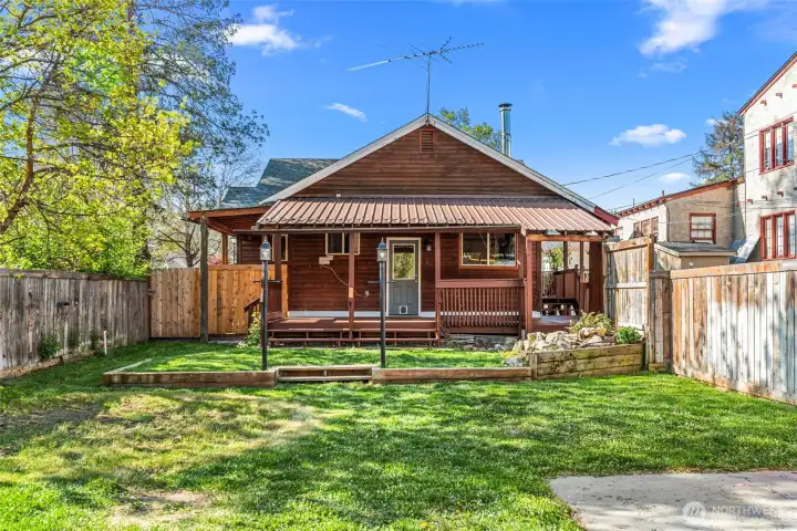 Fully fenced backyard w/ inground sprinklers & alley access
