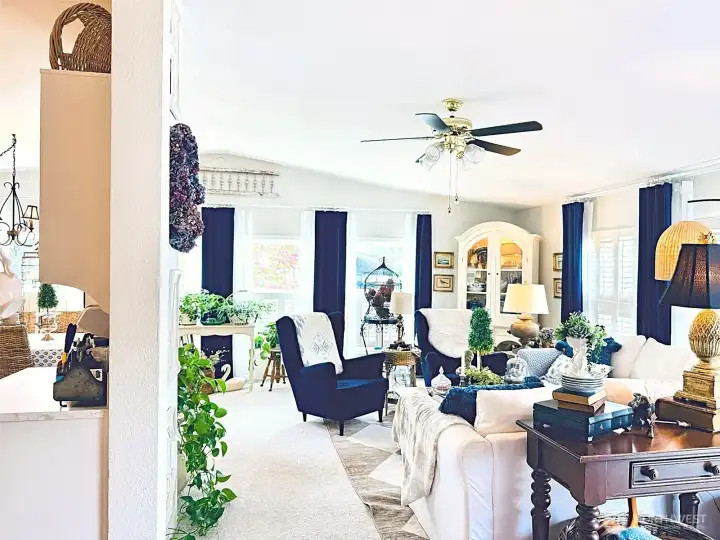 Entryway looking towards living room and a glimpse of the kitchen, light and bright with windows facing the street and pink dogwood tree