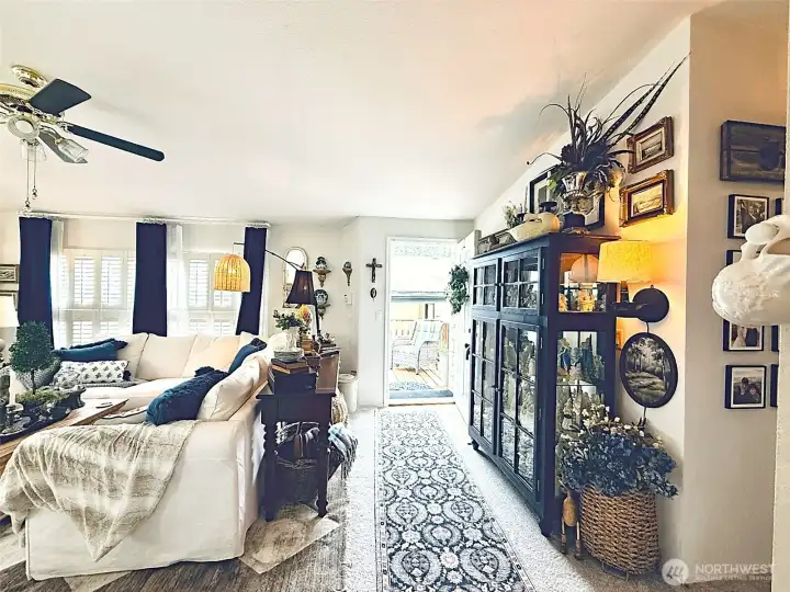 View from front windows looking towards living room, entryway, hallway to 3 bedrooms and 2 bathrooms