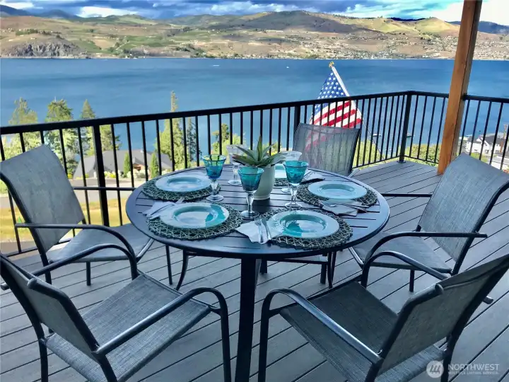 Covered outdoor living designed for summer shade and unforgettable sunsets.