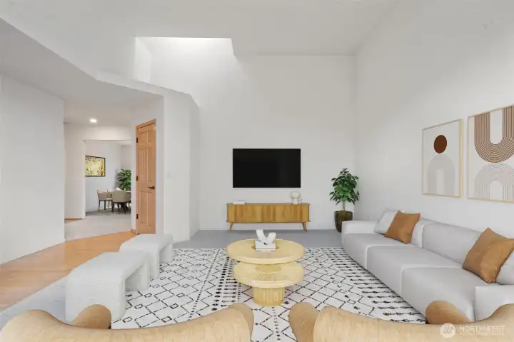 Main Living Room with fresh carpets, skylights & wood floor entry. High ceilings and easy level flow to the rest of the home! Virtually staged to show the potential and size.