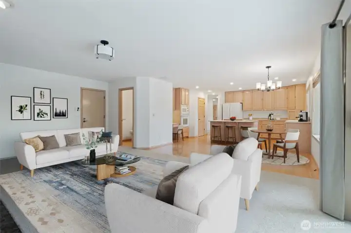 Family Room with large fireplace (flip the switch and it's on)! Great natural light, easy access to deck and trails, garage and half bath. Virtually staged to show you the potential.