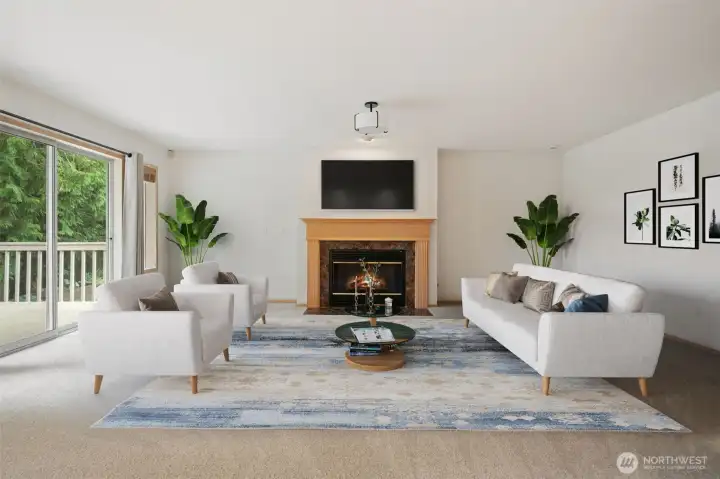 Family Room with large fireplace (flip the switch and it's on)! Great natural light, easy access to deck and trails, garage and half bath. Virtually staged to show you the potential.
