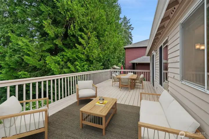 Large back deck with steps to back yard haven and nature trails. Easy access through slider off family room. Virtually staged to show you the potential.