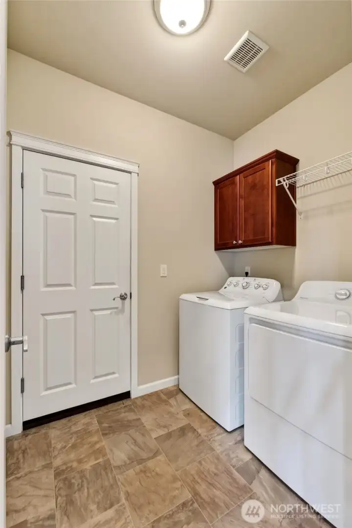 Laundry/Mud Room off of the hall, door leads to the garage. W/D stay.