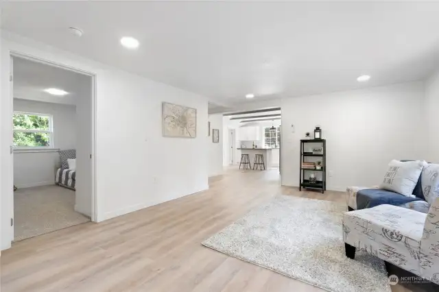 Open floor plan that flows into the kitchen.  NEW flooring throughout the home (carpet and LVP).