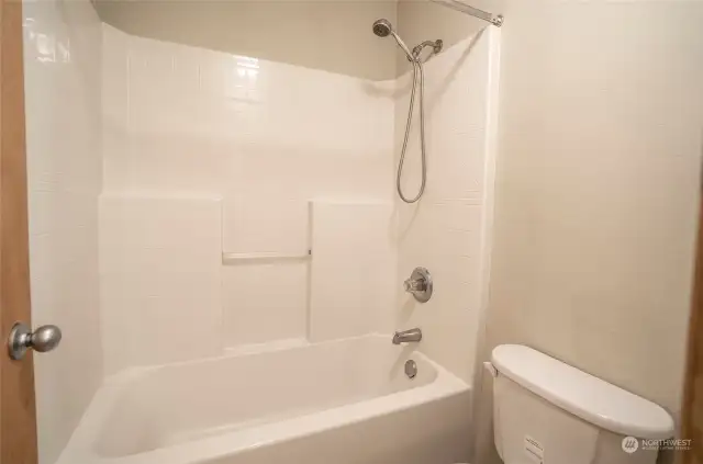 For added privacy, a separate door leads to the tub, shower, and toilet area.