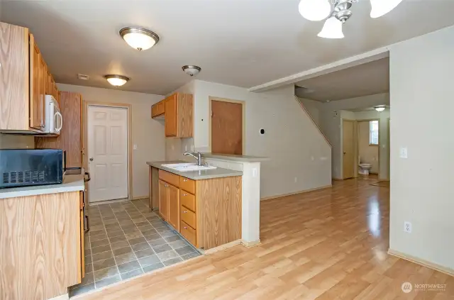 A view of the kitchen and living area from the dining space.