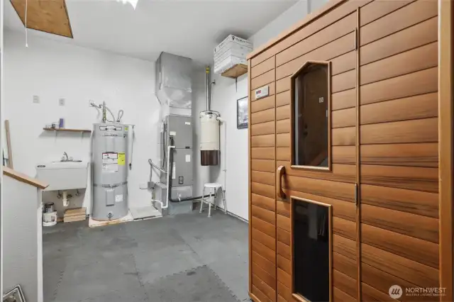 Mud room entryway from garage features sauna.