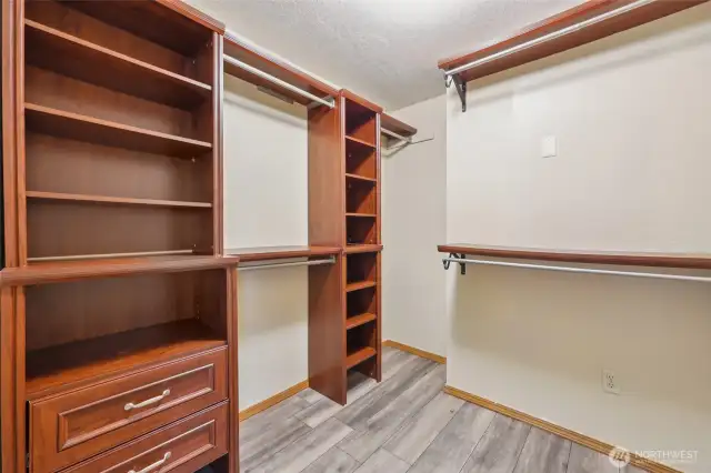 Primary bedroom closet with built-ins.