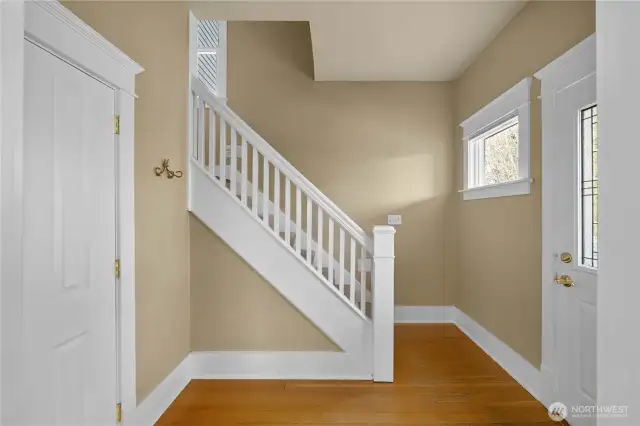 Formal entry and open staircase to second floor