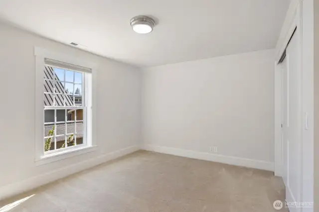 One of 2 bedrooms on the upper floor.