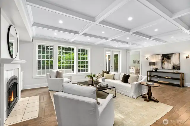 Detailed living room with built in shelves and fireplace.