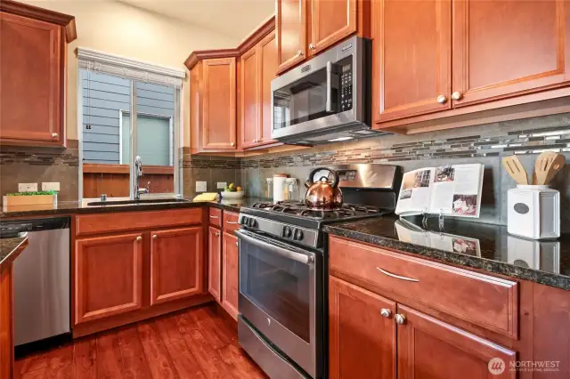 Beautiful, warm cabinetry throughout the kitchen with an added pantry cabinet other homes didn't offer.