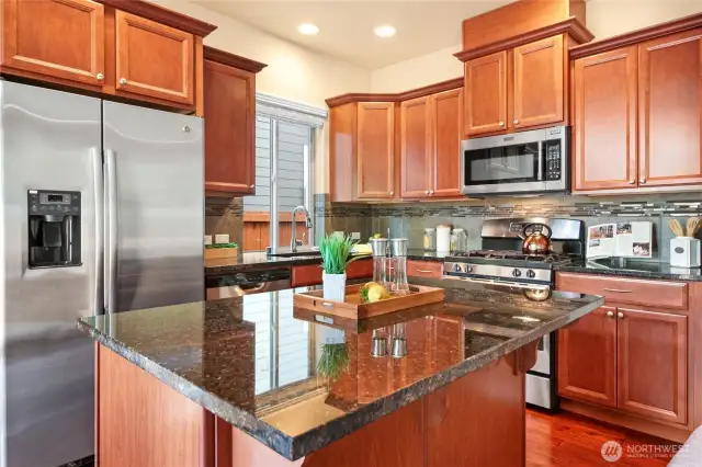 Stainless steel appliances including gas range.