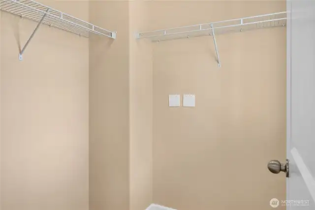 The primary bedroom offers a walk-in closet with window for natural light.