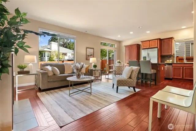 The spacious great room with hardwood flooring.