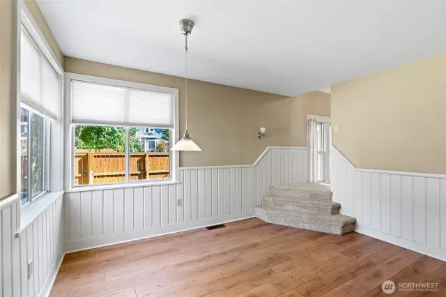 Dining room with stairway up to the 2nd floor.  Look at all that light!