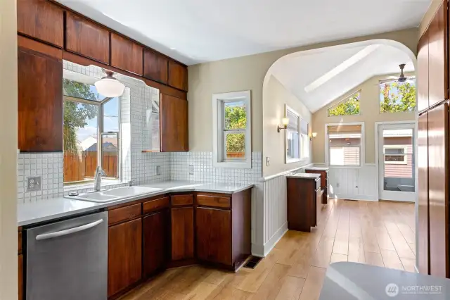 Amazing kitchen with lots of light, garden window, stainless appliances, and pantry.