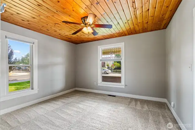 Main floor bedroom with great windows, tongue and groove ceiling and ceiling fan.
