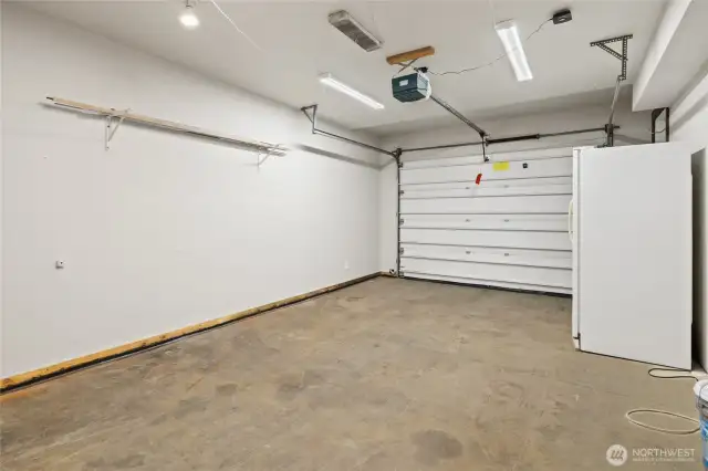Single car garage, garage refrigerator stays.