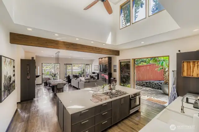 Great room consisting of an updated kitchen, living room with gas fireplace, dining room area and don't miss the wet bar area.