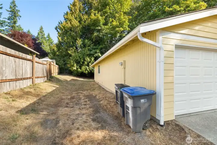 Side of house offers plenty of parking for recreational vehicles or toys.