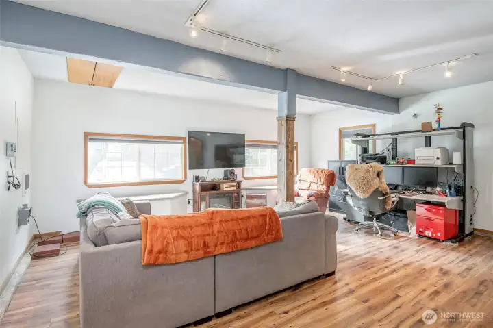 This rec room is even larger when you see it in person! Current owner uses it as his movie room and office. You can fit a huge sectional in here and entertain! There is also a door from this room to the covered breezeway leading to the detached garage.
