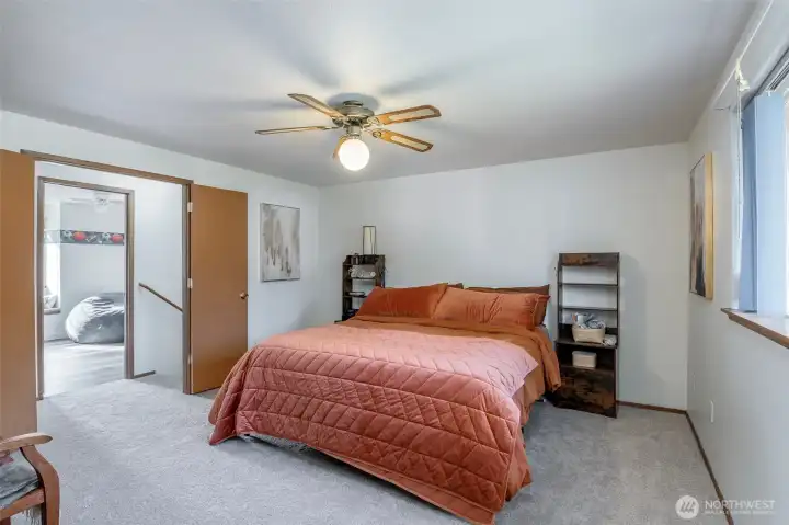 Primary bedroom. Enter through french doors. Here, you'll find double closets and an attached bathroom.