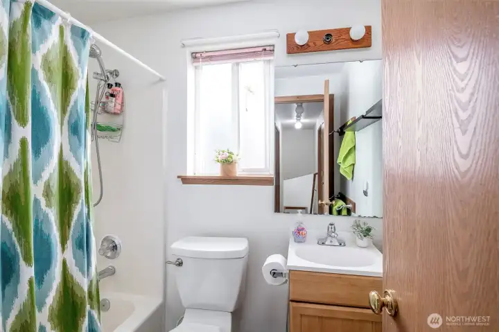 Full bathroom located in hallway upstairs