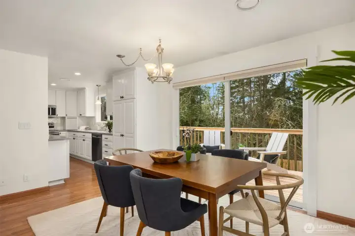 The dining area is spacious and flows out to the newly restored deck and sliding glass door.
