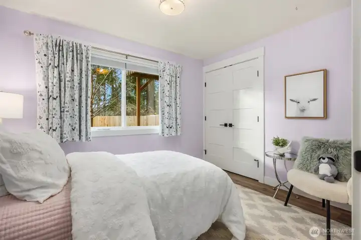 Second lower level bedroom with views of the backyard.