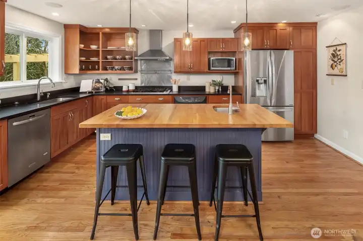 Freshly painted with new lighting, this remodeled kitchen with loads of storage space is a wonder to behold and also so comfortable.
