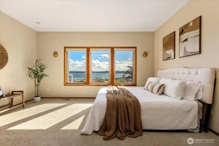 Imagine waking up here! Enjoy coffee or a book from bed and never lose sight of the views.
