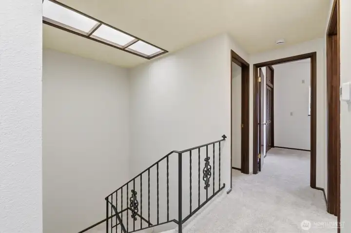 Upperhall off entry andsHuge laundry Main hallway off foyer and stairs leading to basement.