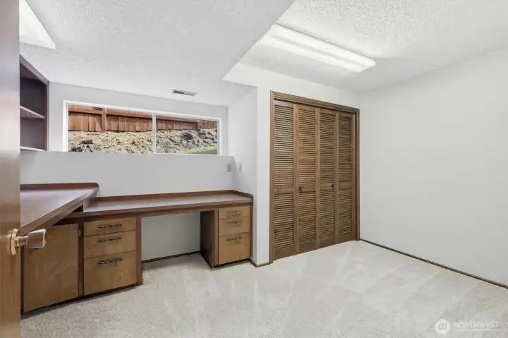 Downstairs back Office/den/Hobbyroom with tons of custom built-ins.