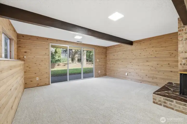 Cozy recroom living spaces with slider to large patio and park-like backyard.