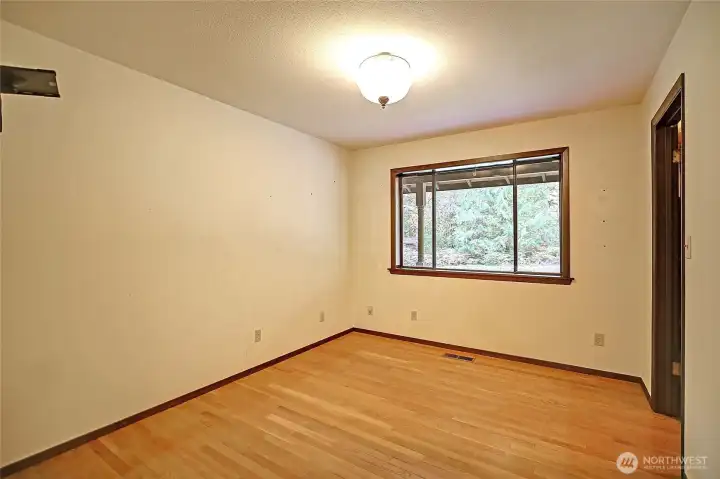 Third bedroom with walk in closet on the other side of the home near garage side.