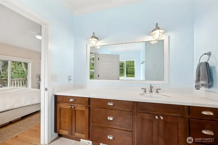 main ensuite bathroom with natural light, garden tub and walk in shower