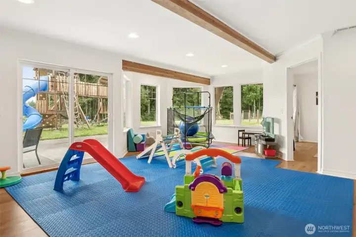 large open living/play/theatre area on lower level