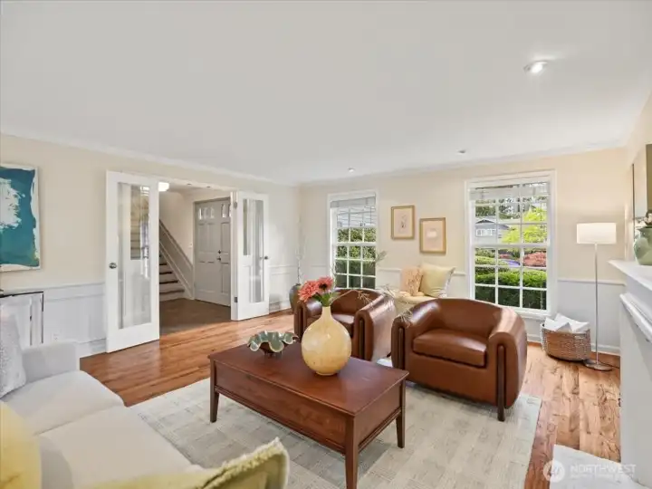 From the moment you step inside, you're welcomed by a light-filled living room—windows to the north and south bring in beautiful natural light all day.