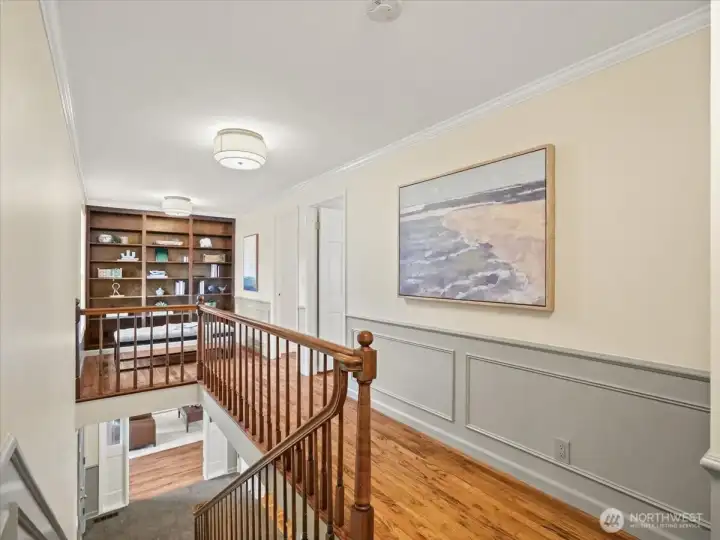 Beautiful woodwork is showcased throughout—from carved banisters to built-in shelving and classic wainscoting—adding warmth and character at every turn.