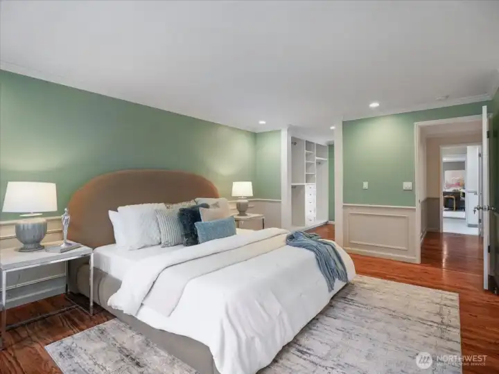 Upstairs, a serene primary suite offers generous closet space and easy access to the nearby bedrooms.